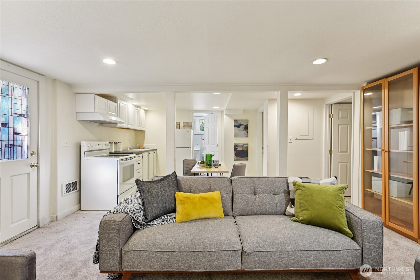 511 23rd Avenue East Seattle, WA 98112 - Photo 33 of 39 a living room with furniture and kitchen view