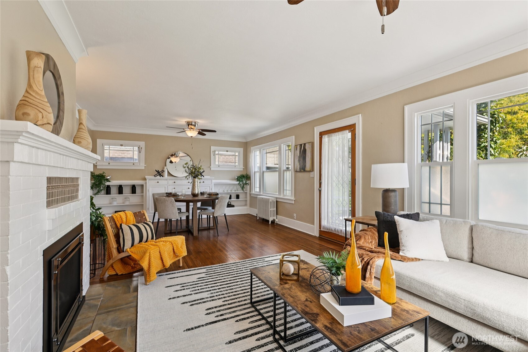 511 23rd Avenue East Seattle, WA 98112 - Photo 6 of 39 a living room with furniture and a fireplace