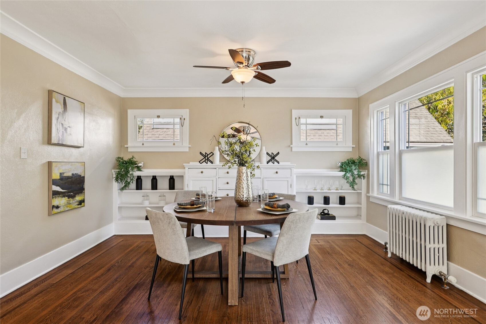 511 23rd Avenue East Seattle, WA 98112 - Photo 8 of 39 a dining room with furniture potted plants and wooden floor