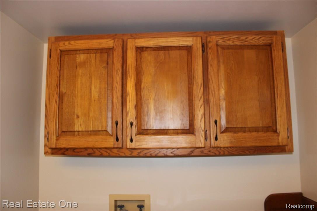 5417 Eagle Road Highland, MI 48356 - Photo 30 of 44 Storage above washer/dryer