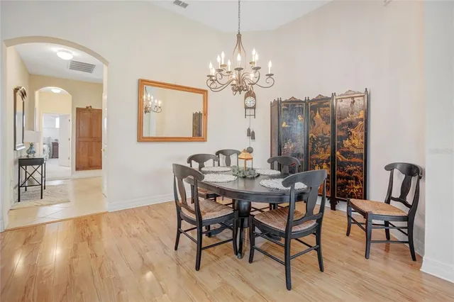 a living room with furniture a flat screen tv and a window