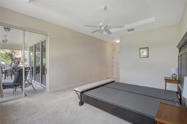 a bedroom with a bed and a lamp