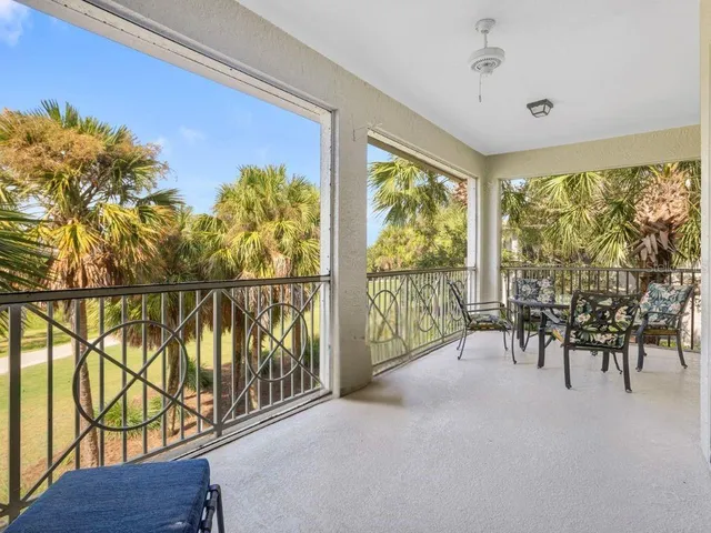 an aerial view of residential houses with outdoor space and lake view