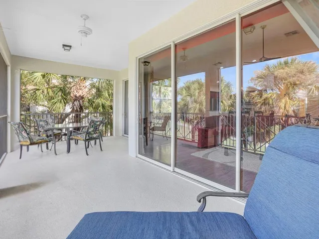 an aerial view of residential houses with outdoor space and river