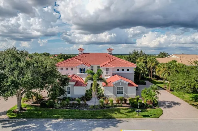 an aerial view of a house with a lake view
