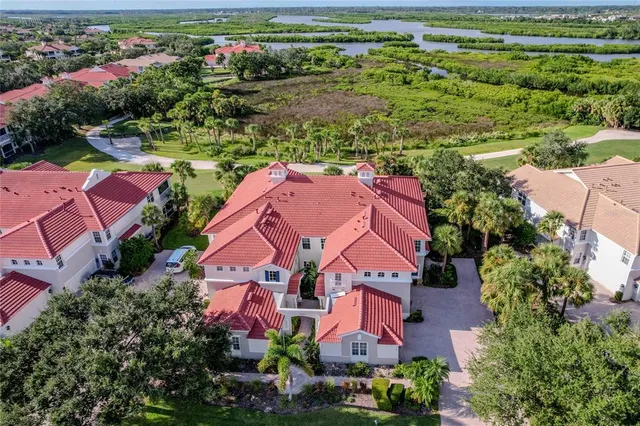 an aerial view of a house with outdoor space
