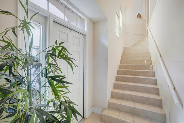 a view of staircase with white walls