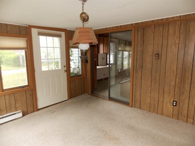 22 Iyanough Road Hyannis, MA 02601 - Photo 5 of 17 an empty room with windows and entryway