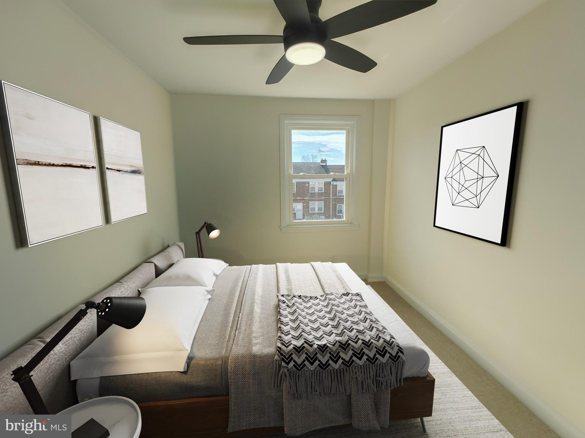 1525 Medford Road Baltimore, MD 21218 - Photo 18 of 39 a bedroom with a bed and wooden floor