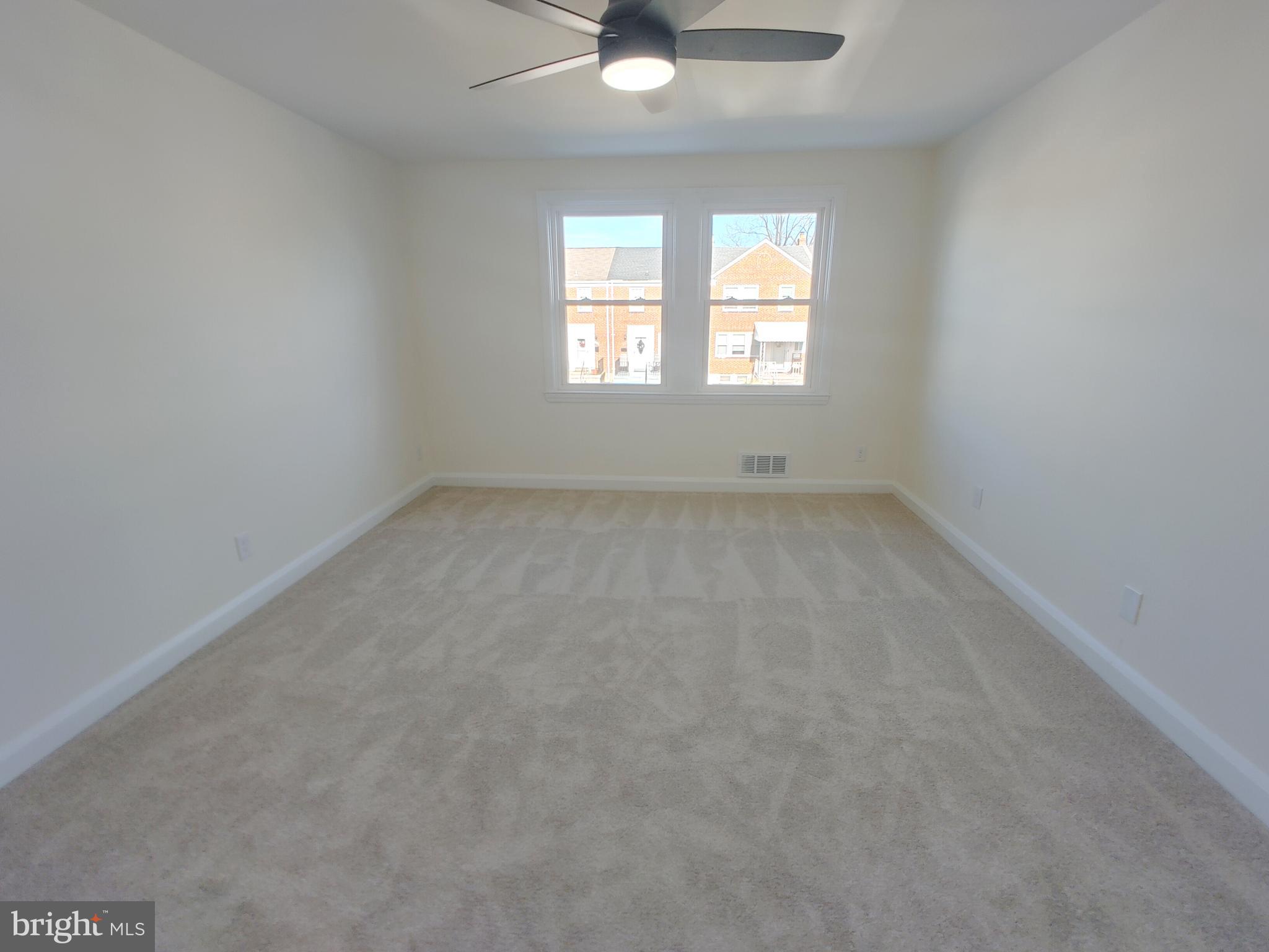 1525 Medford Road Baltimore, MD 21218 - Photo 21 of 39 an empty room that has a window