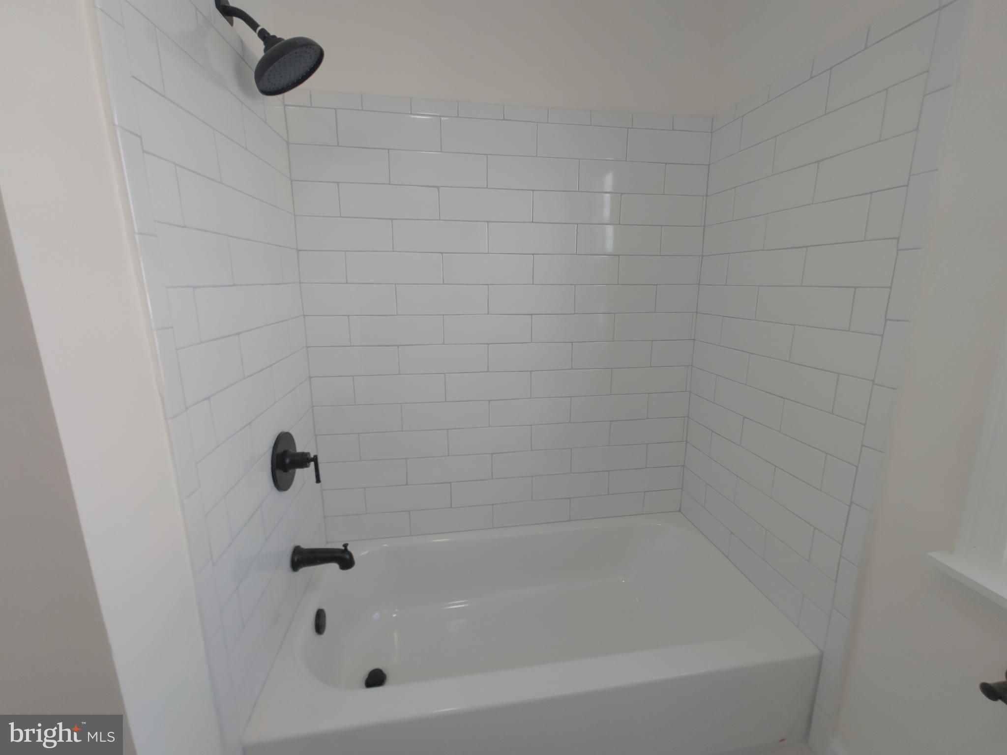 1525 Medford Road Baltimore, MD 21218 - Photo 29 of 39 a close up of a bathtub