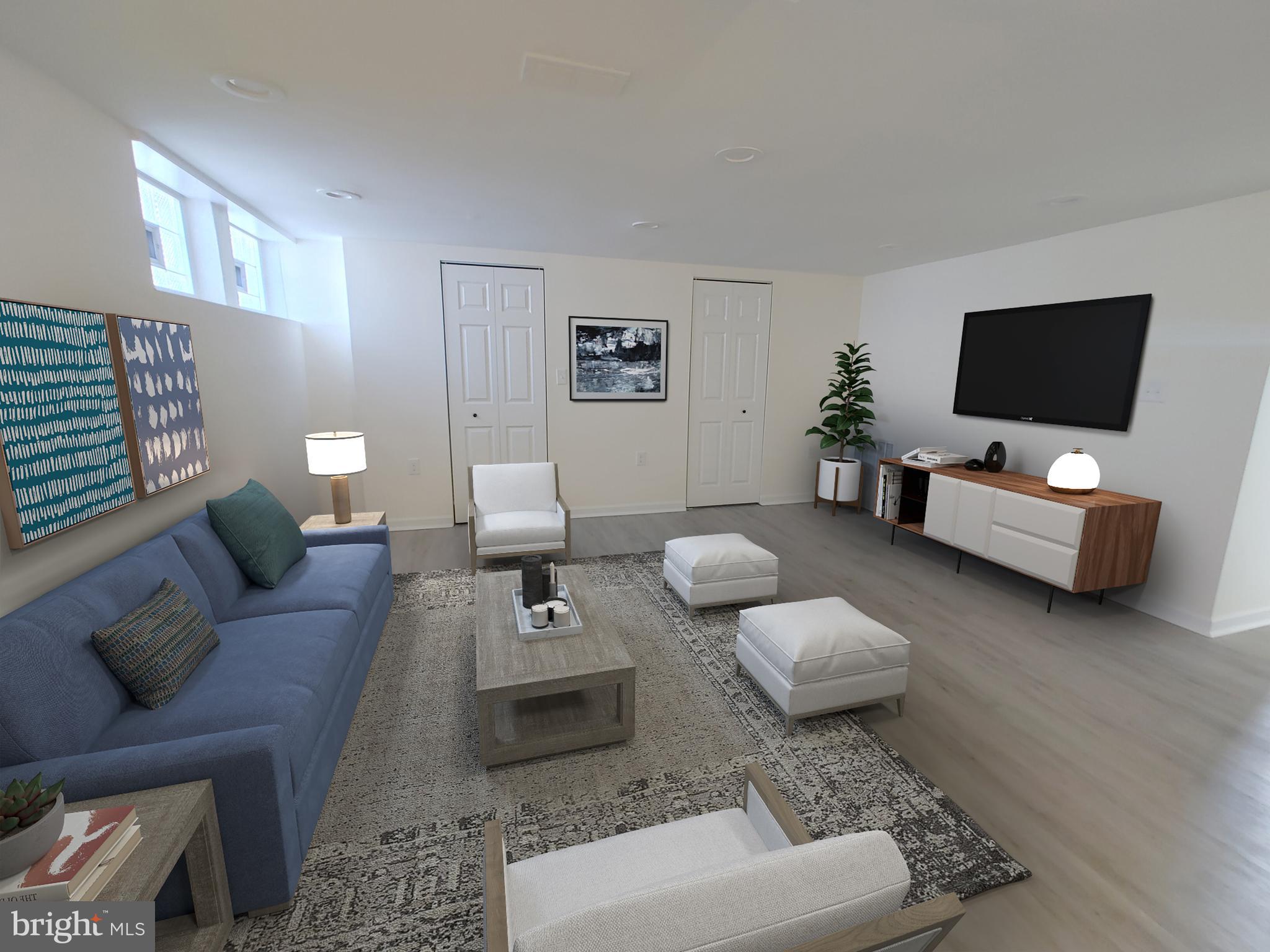 1525 Medford Road Baltimore, MD 21218 - Photo 34 of 39 a living room with furniture and a flat screen tv