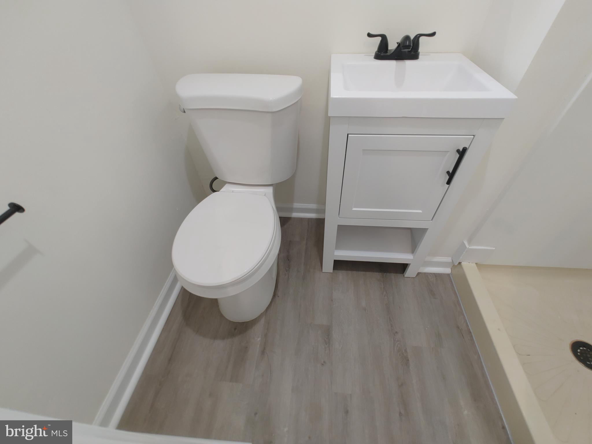 1525 Medford Road Baltimore, MD 21218 - Photo 38 of 39 a bathroom with a toilet and a sink