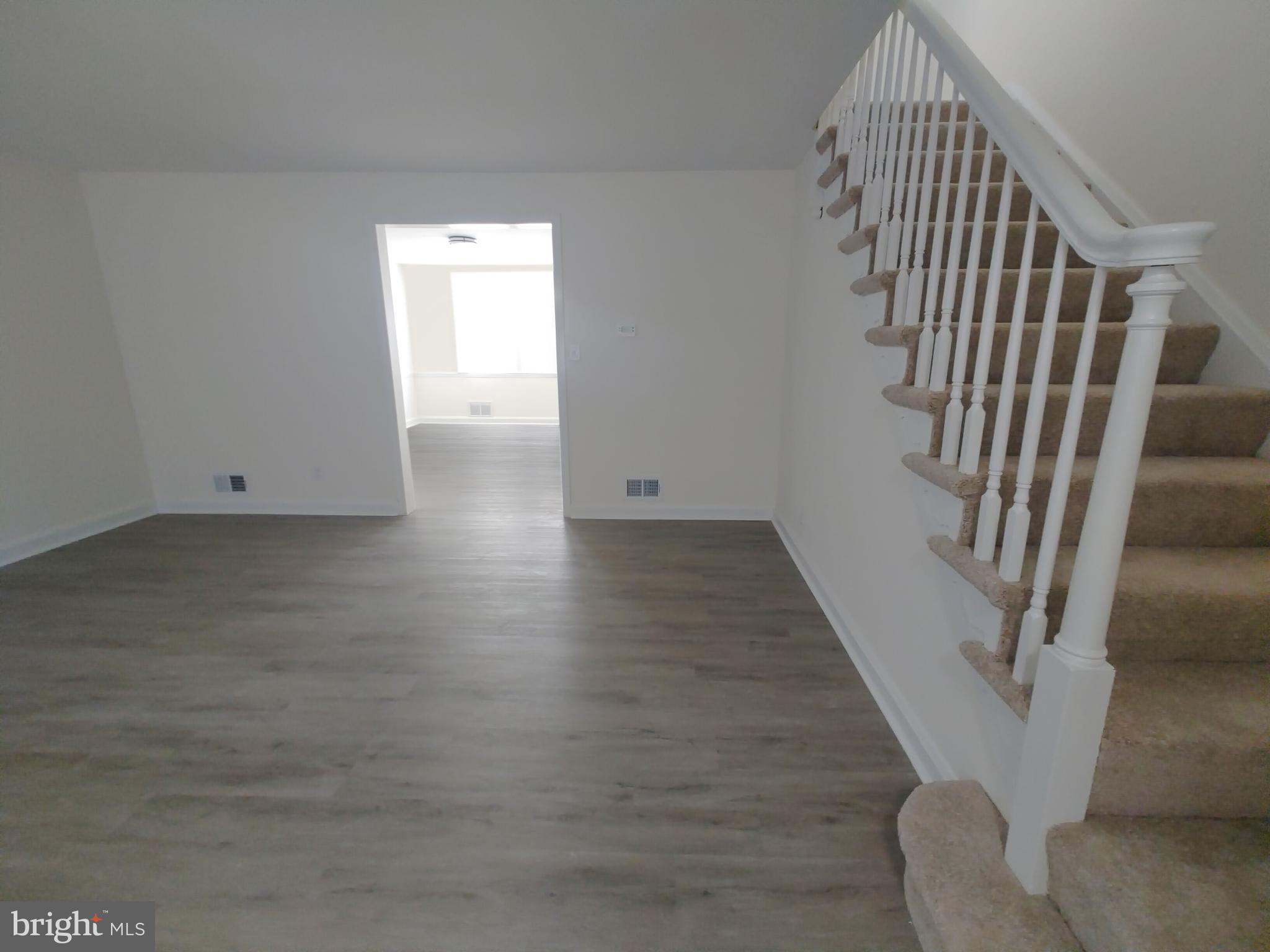 1525 Medford Road Baltimore, MD 21218 - Photo 8 of 39 an entryway in a hall with wooden floor