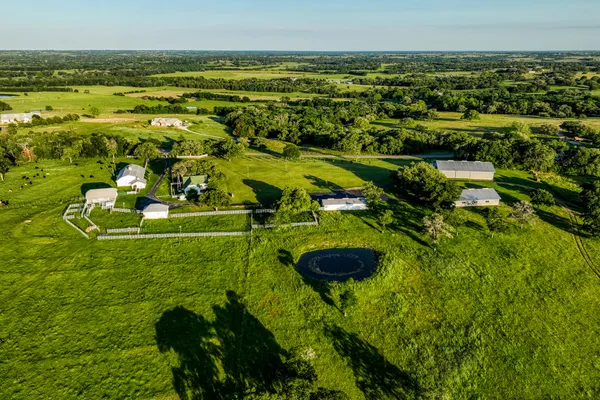 an aerial view of residential houses with outdoor space