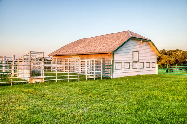 a view of a house with a backyard and a garden