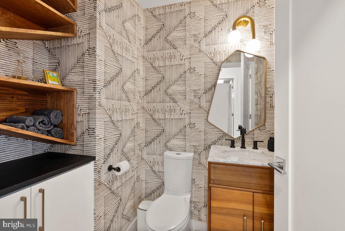1211 Van Street Southeast, Unit PH13B Washington, DC 20003 - Photo 12 of 25 a bathroom with a sink and a toilet