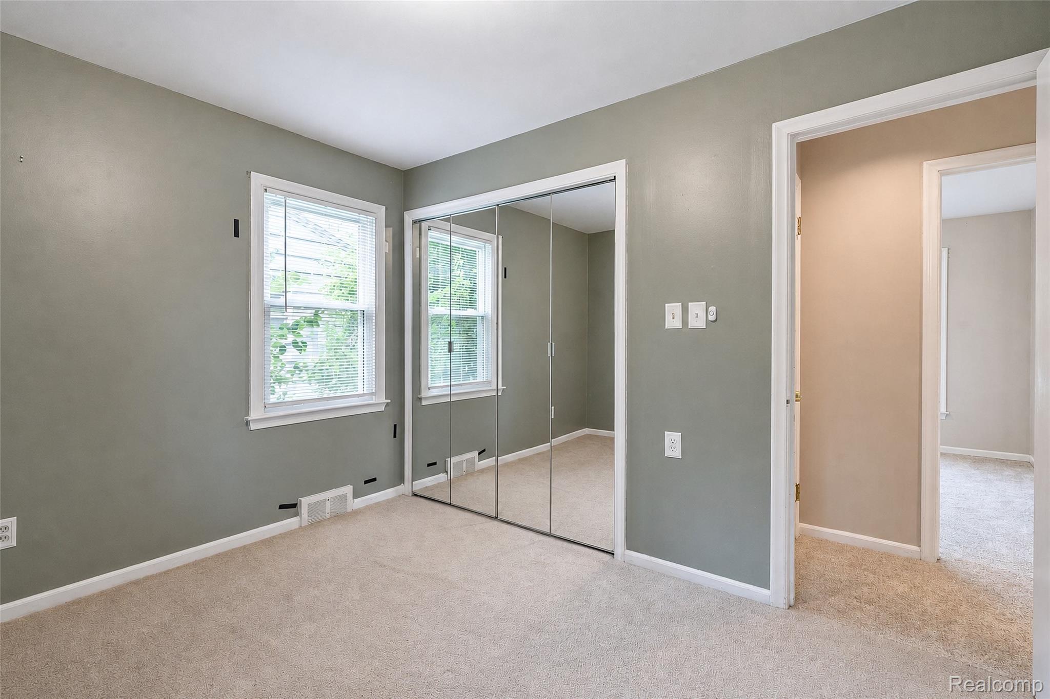 1846 Pembroke Road Birmingham, MI 48009 - Photo 37 of 37 Wall-to-wall carpeting with multiple windows and mirrored closet doors