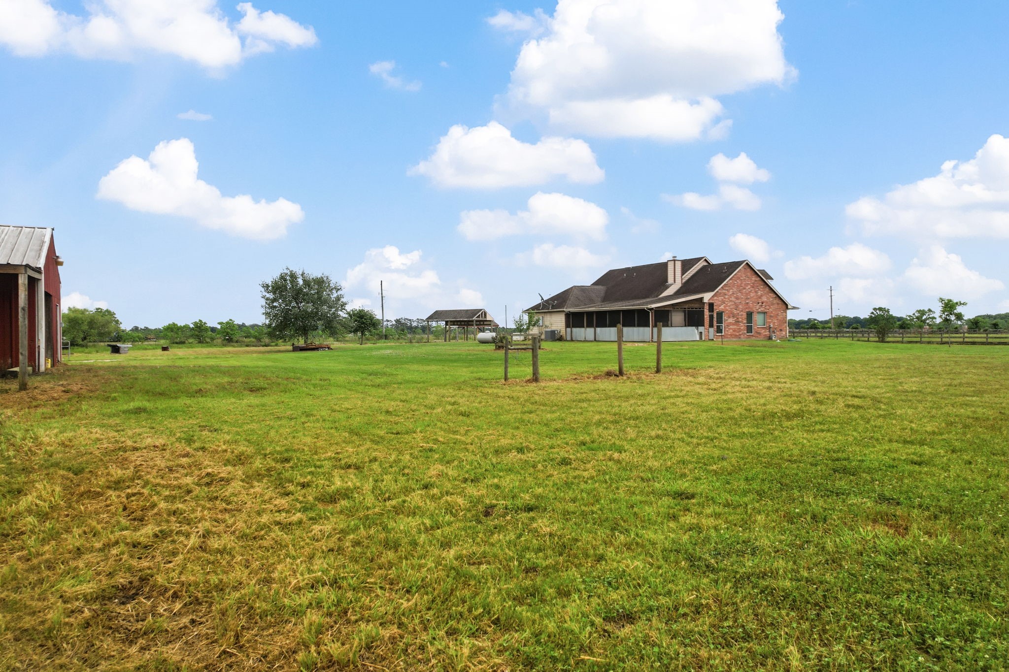 1405 Big Hill Road Winnie, TX 77665 - Photo 9 of 43 a view of a house with a big yard