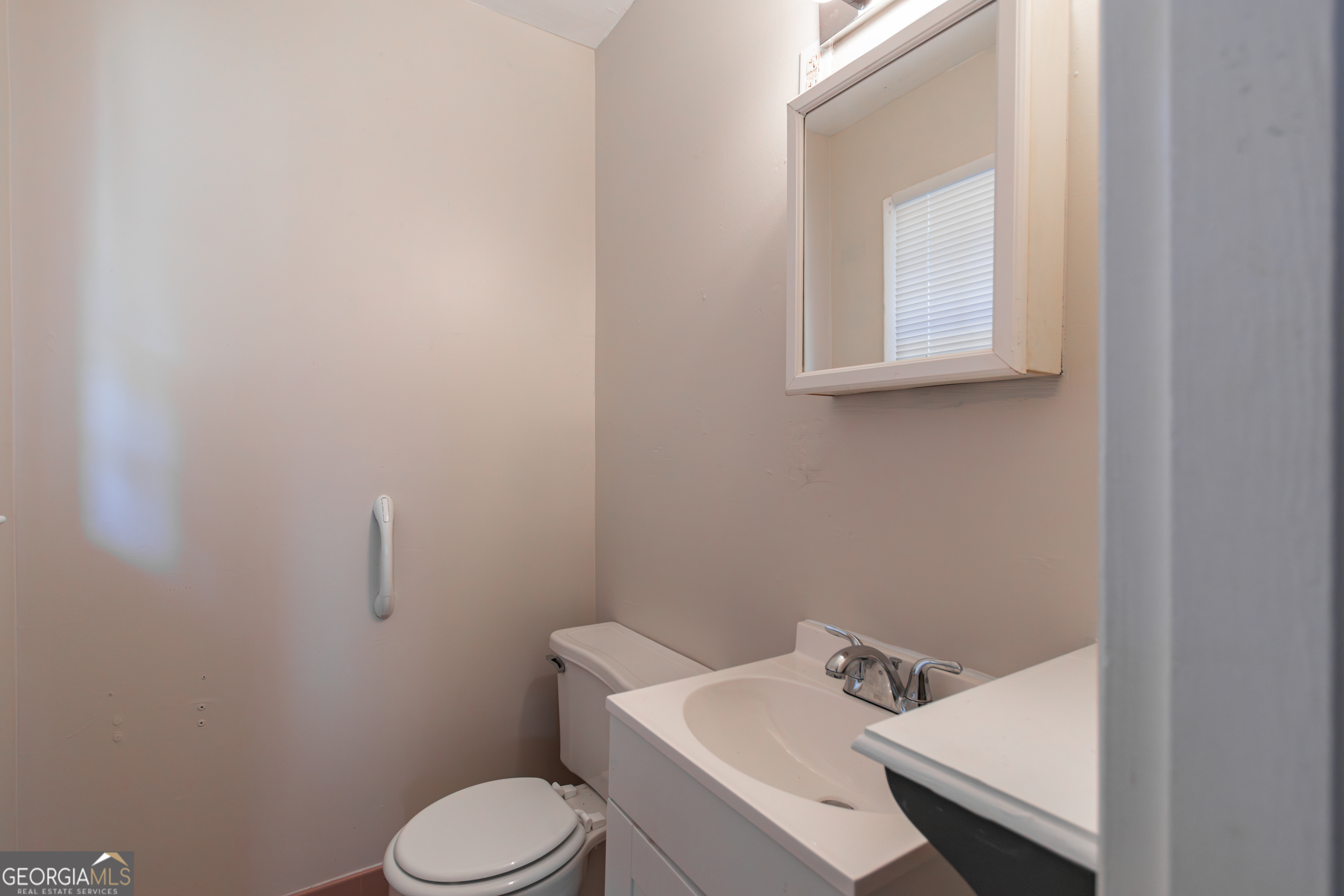 208 Bassett Street Centerville, GA 31028 - Photo 18 of 24 a bathroom with a sink and a toilet