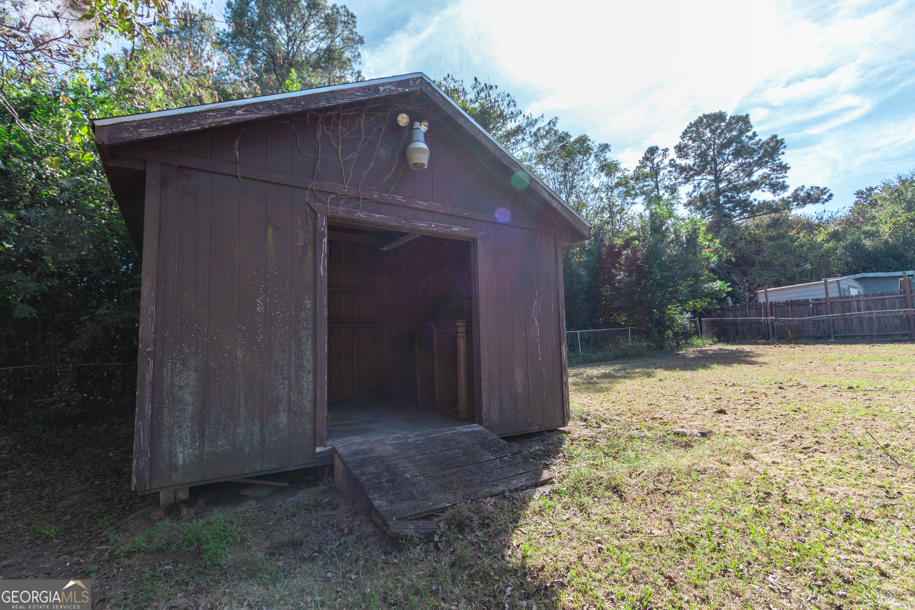 208 Bassett Street Centerville, GA 31028 - Photo 7 of 24 front view of a house with a yard