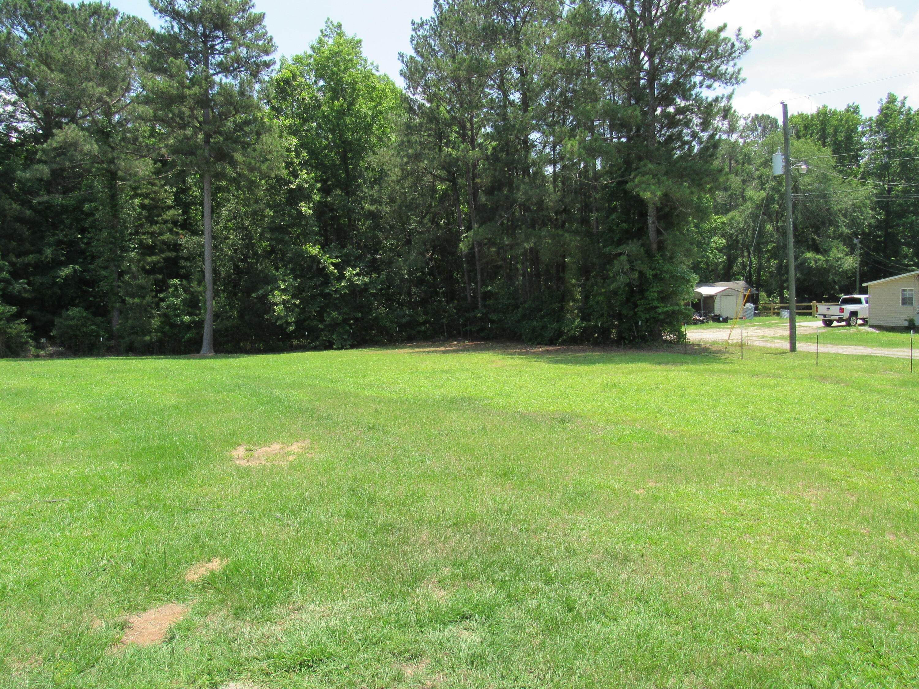 614 Hamilton Road Grovetown, GA 30813 - Photo 23 of 24 1.7 acre lot. The backyard is fenced with a big gate to drive yard tools through.
