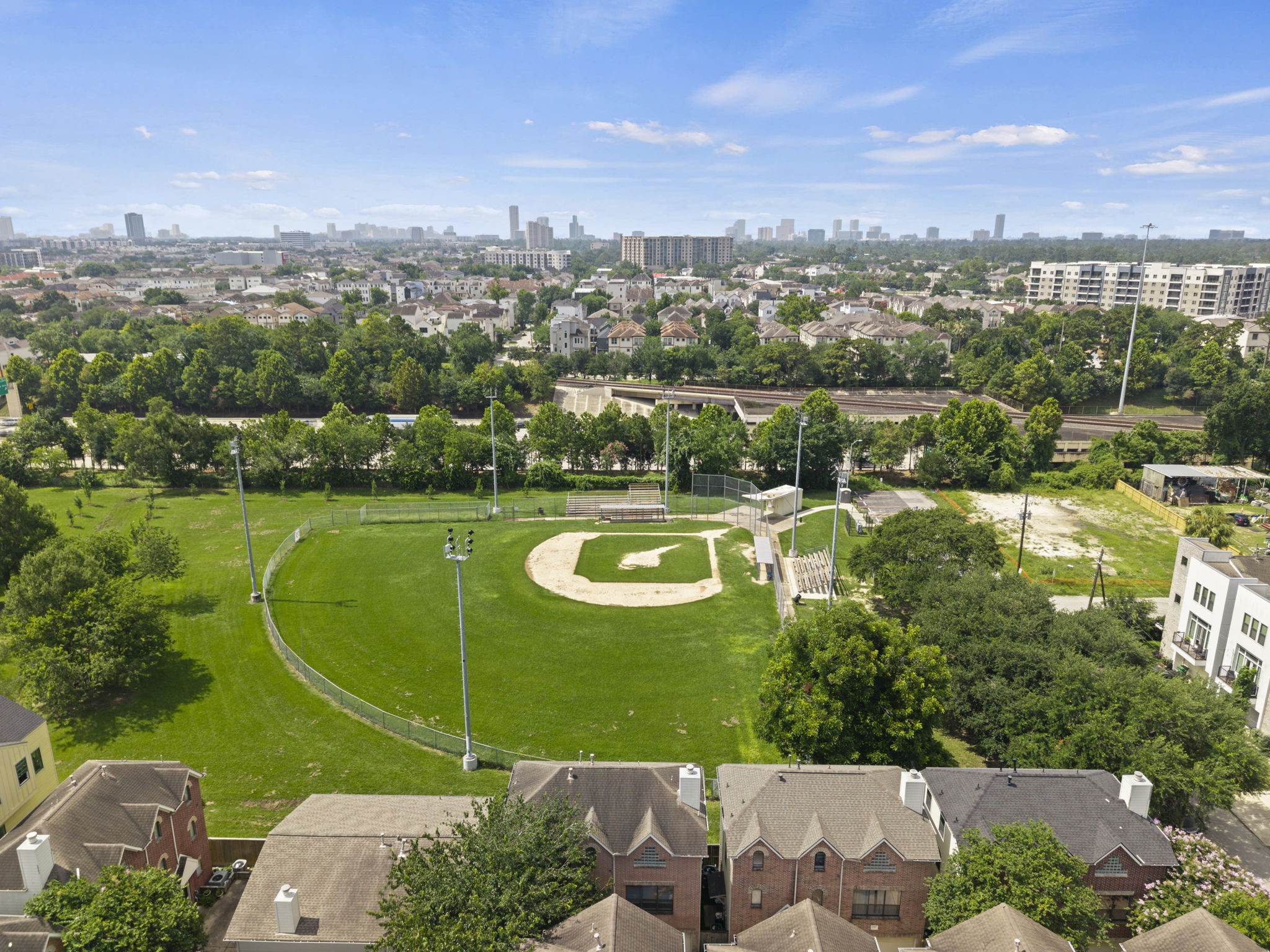 2154 Arabelle Street Houston, TX 77007 - Photo 9 of 45 From above, the location becomes one of the home’s strongest features. The surrounding neighborhood, nearby green space, and skyline backdrop give the property a true inner-loop feel.