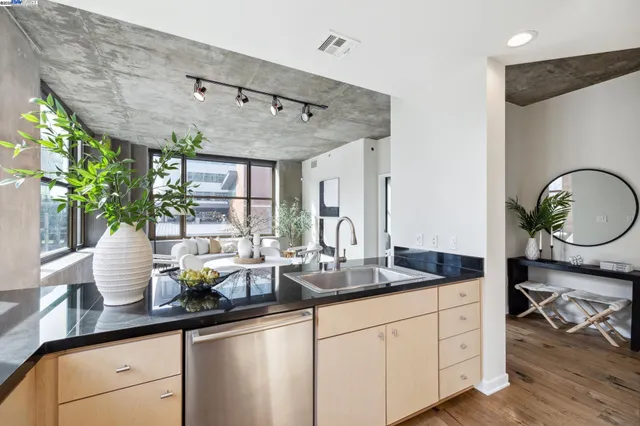 a kitchen with sink a stove and cabinets