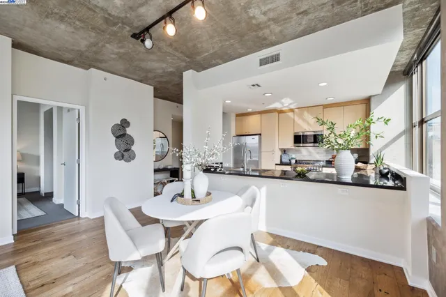 a kitchen with stainless steel appliances kitchen island granite countertop a sink and cabinets