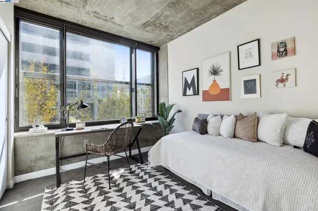 a bed room with a bed and a chair