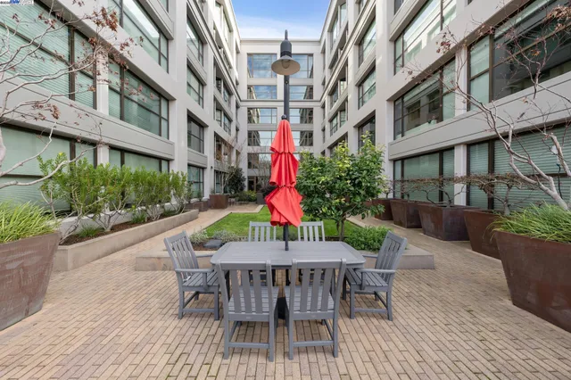 a patio with a table and chairs