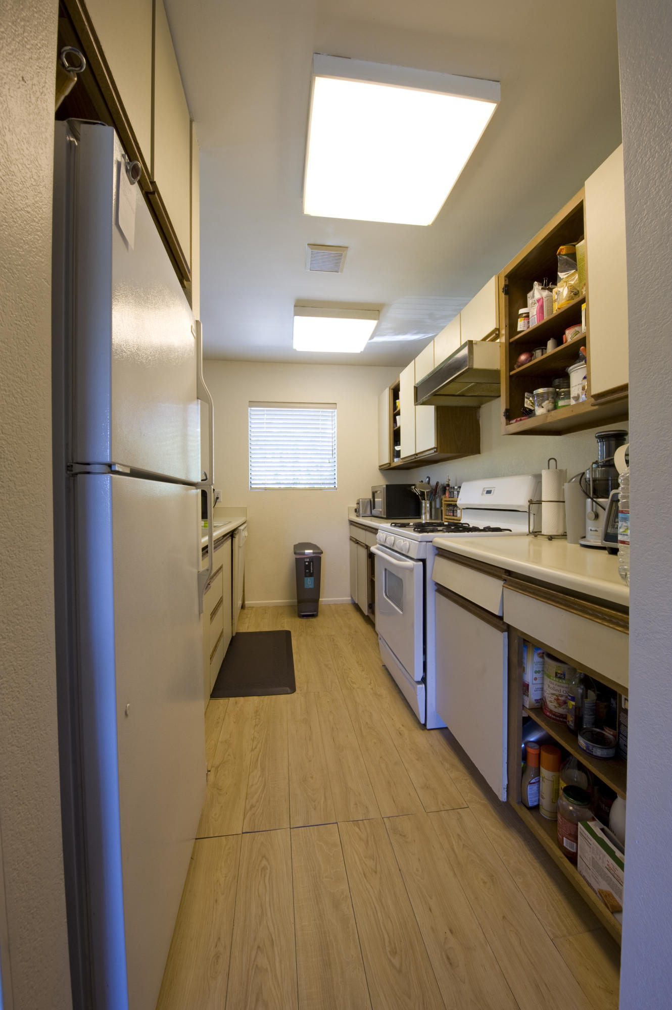 3558 Modoc Road, Unit 37 Santa Barbara, CA 93105 - Photo 4 of 12 a kitchen with stainless steel appliances granite countertop a refrigerator and a stove top oven