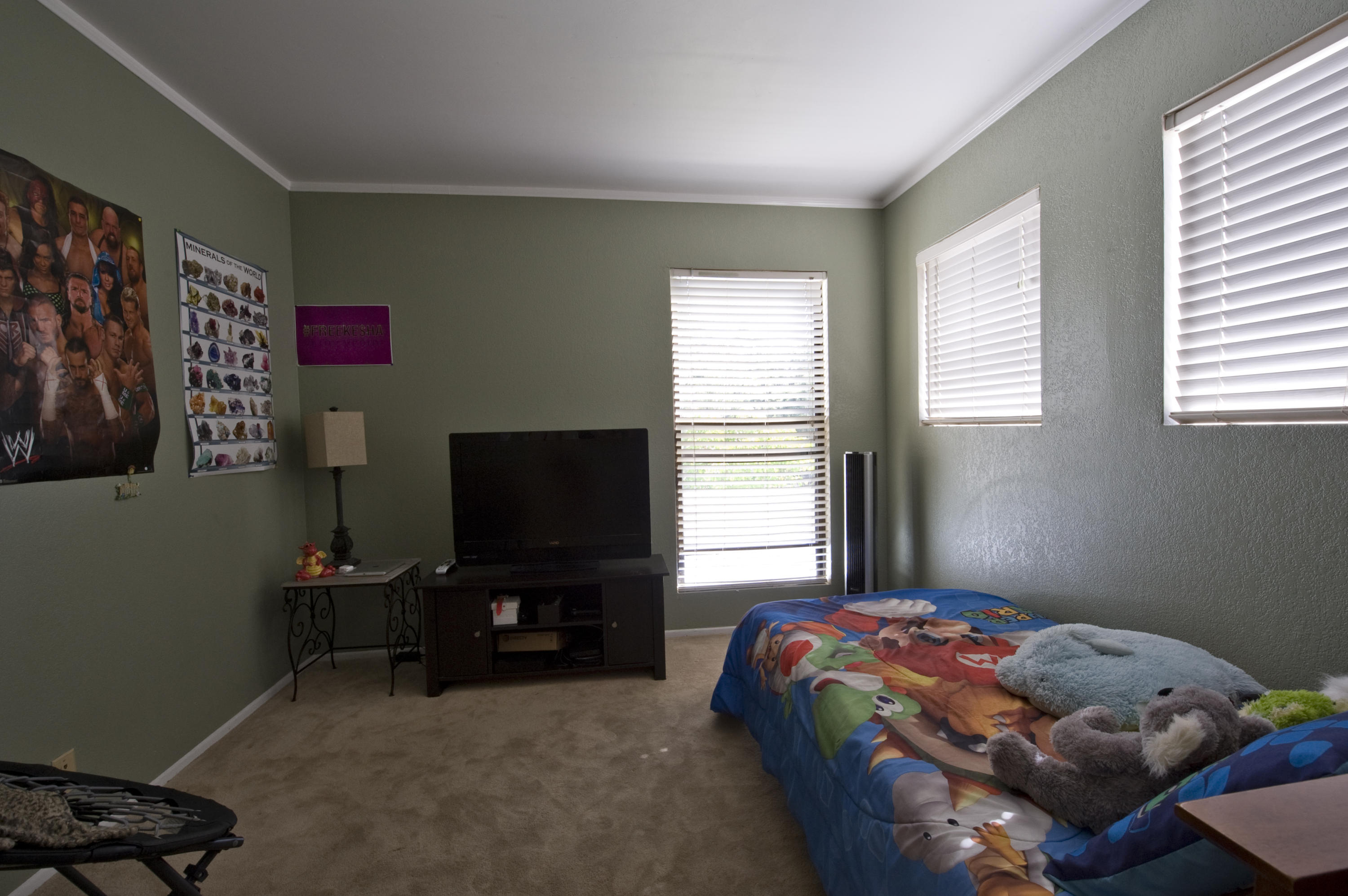 3558 Modoc Road, Unit 37 Santa Barbara, CA 93105 - Photo 9 of 12 a bedroom with a bed and a flat screen tv