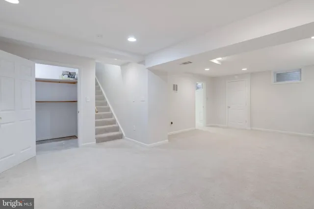 a view of an empty room with stairs