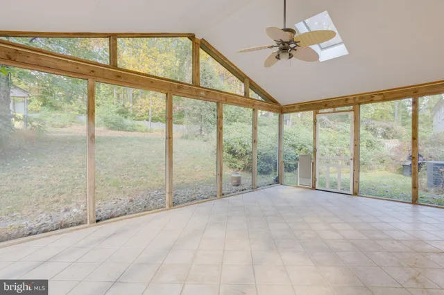 a view of an empty room with windows