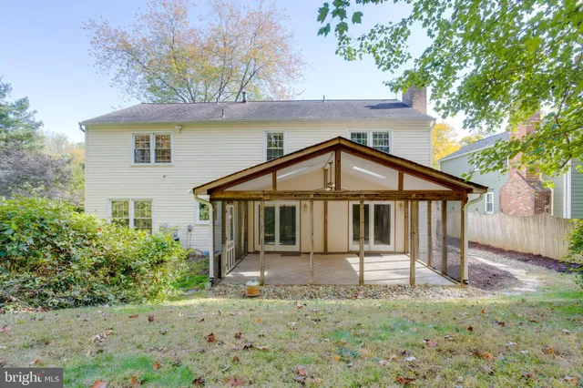 a house that has a small yard next to a yard