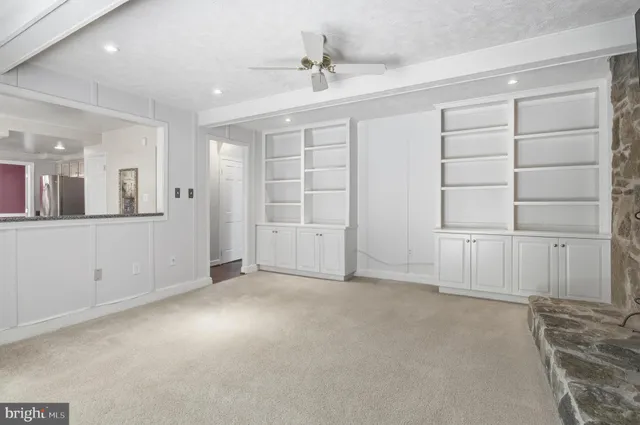 an empty room with a empty space and windows