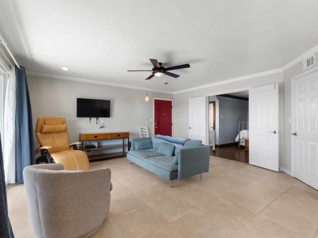 852 Dewitt Avenue Encinitas, CA 92024 - Photo 11 of 41 a living room with furniture and a flat screen tv