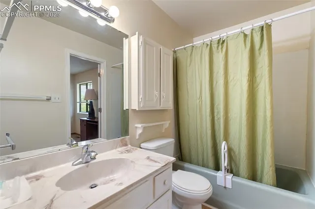 a bed sitting in a room next to a window