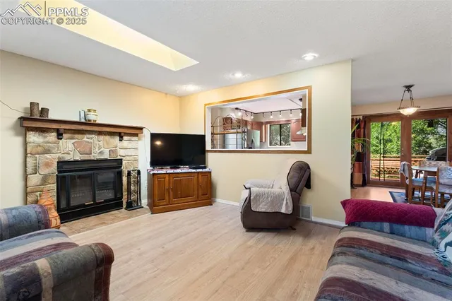 a living room with couches and a large window