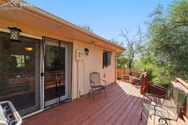a view of a house with a yard balcony and furniture