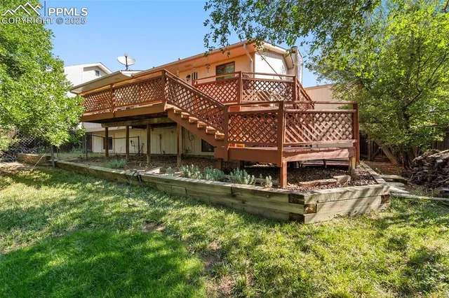 a aerial view of a house with a yard