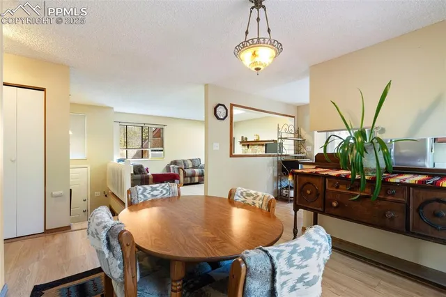 a bedroom with a bed next to a window