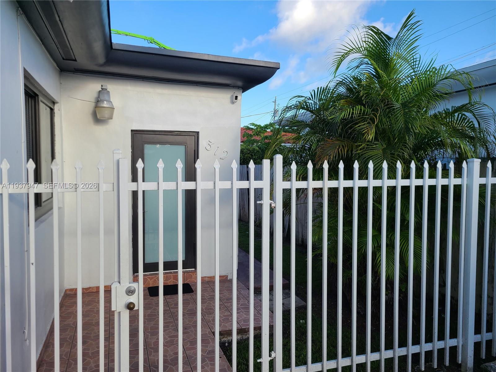 310-312 Southwest 36th Avenue Miami, FL 33135 - Photo 8 of 15 a view of a wooden fence