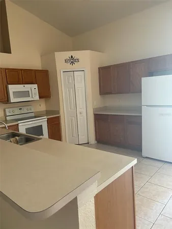 a utility room with washer and dryer
