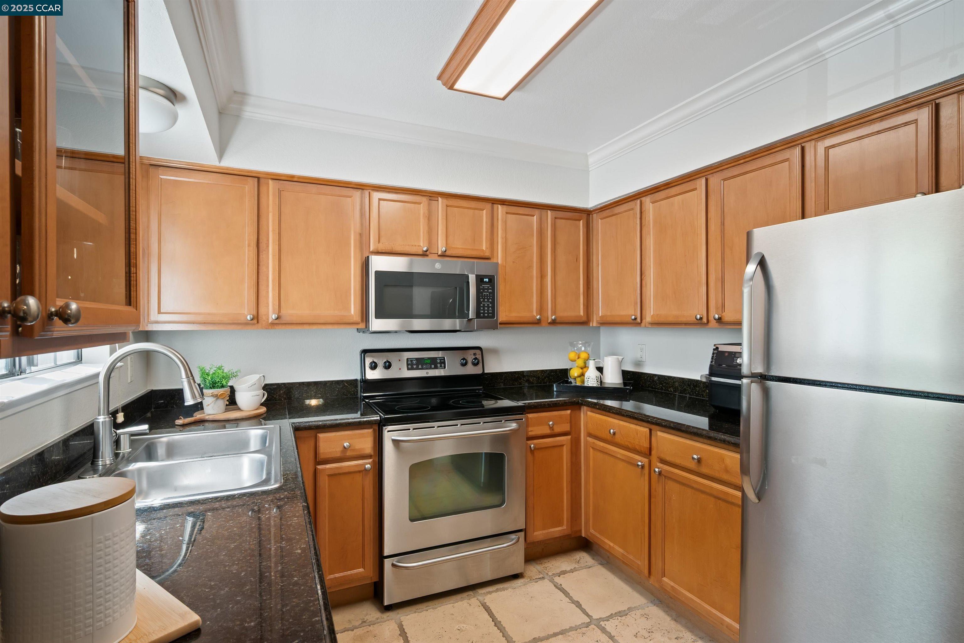 332 Eastridge Drive San Ramon, CA 94582 - Photo 16 of 36 a kitchen with white cabinets sink and white appliances