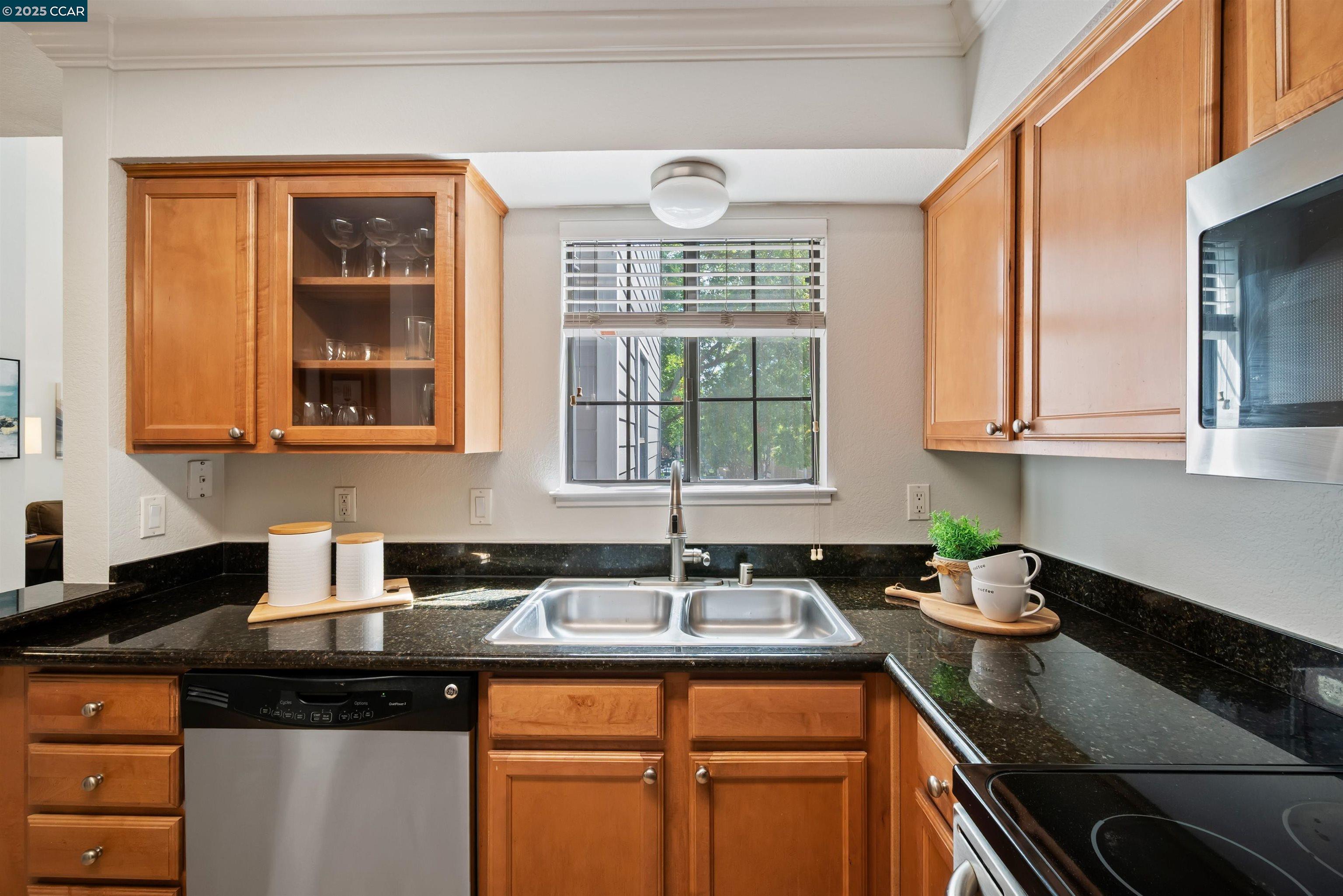 332 Eastridge Drive San Ramon, CA 94582 - Photo 17 of 36 a kitchen with stainless steel appliances granite countertop a sink and a white cabinets