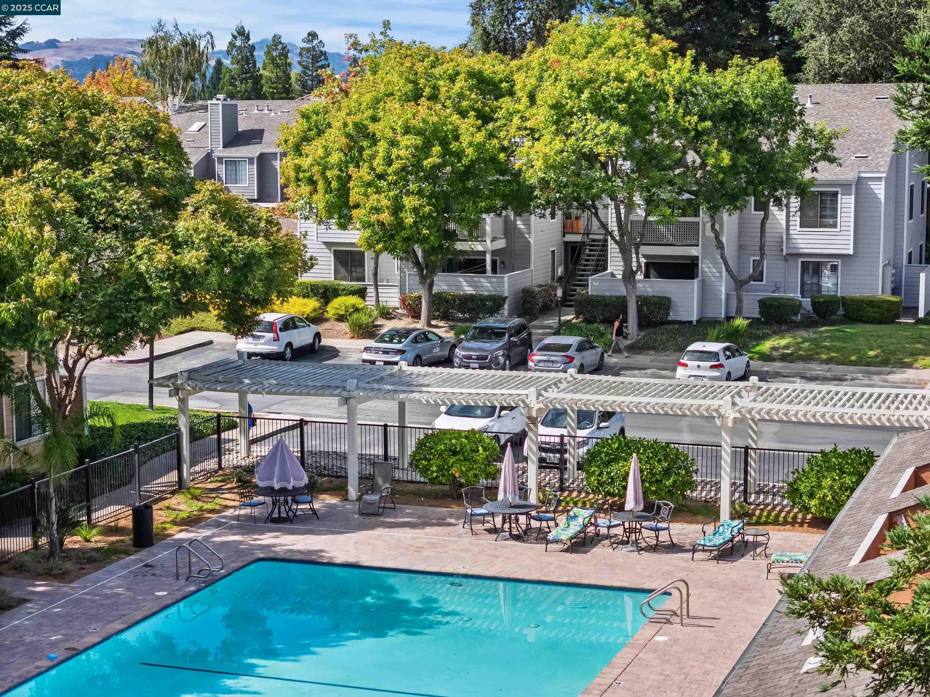 332 Eastridge Drive San Ramon, CA 94582 - Photo 33 of 36 a view of a patio with table and chairs potted plants and large tree