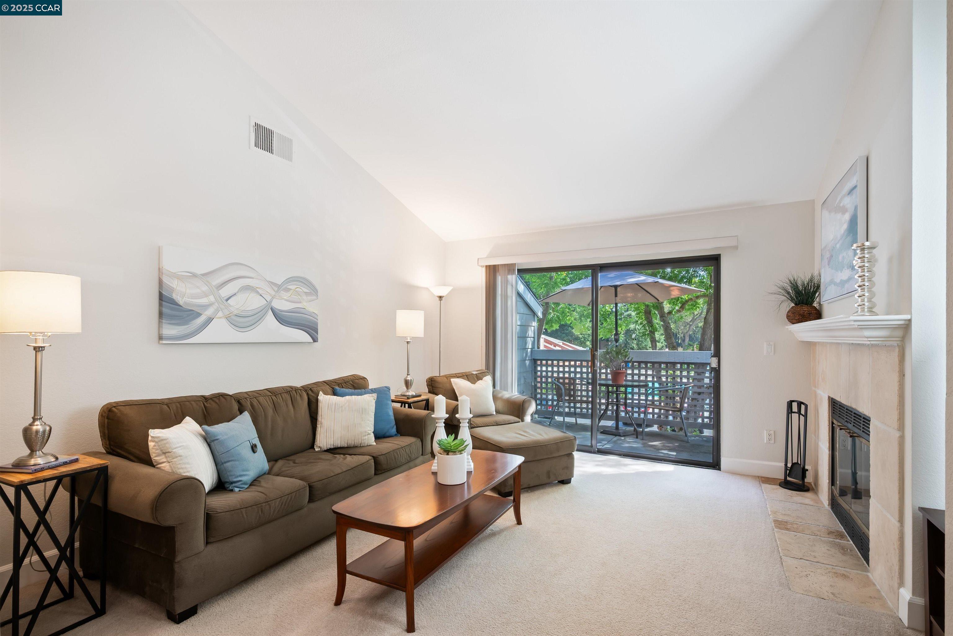 332 Eastridge Drive San Ramon, CA 94582 - Photo 10 of 36 a living room with furniture a fireplace and a large window