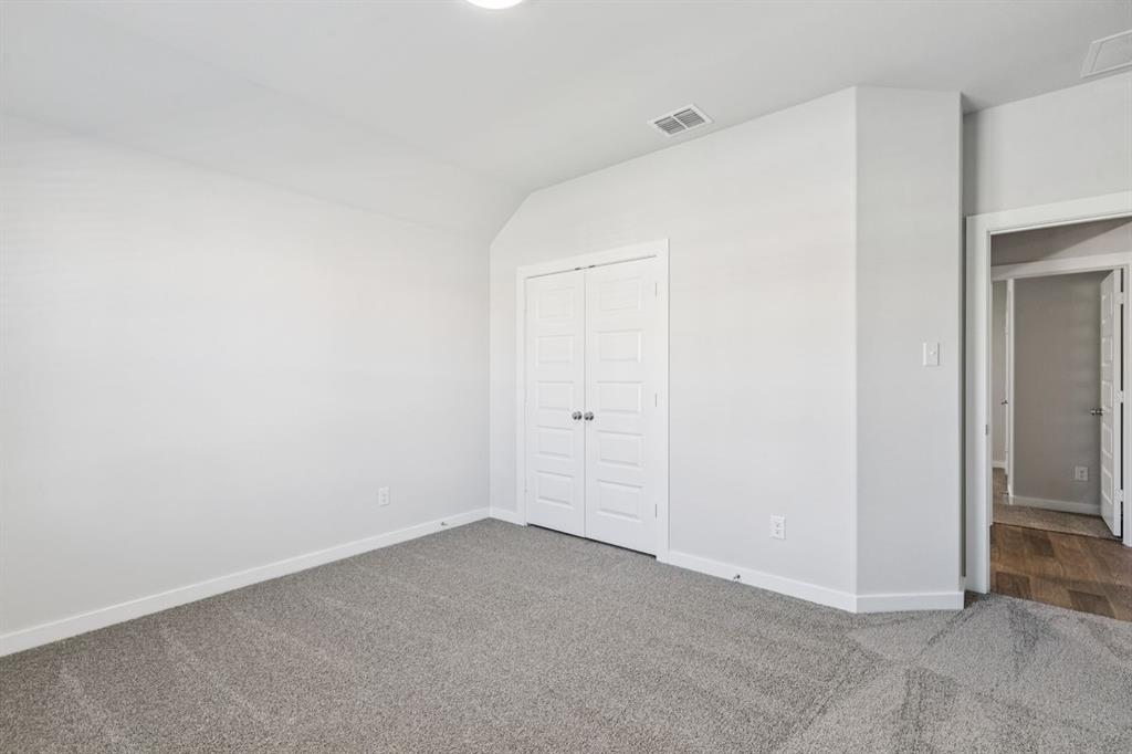 361 Yellowstar Lane Lavon, TX 75166 - Photo 21 of 33 Bedroom in the Oscar home plan by Trophy Signature Homes – REPRESENTATIVE PHOTO